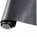 Close-up of glossy black 5D carbon fiber vinyl wrap roll