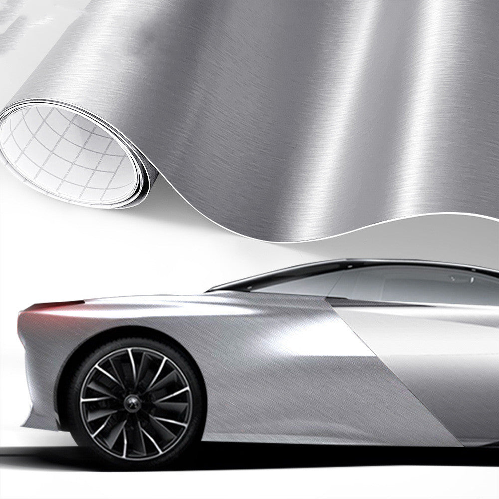 Brushed-metal style vinyl wrap film shown on a car (light grey)