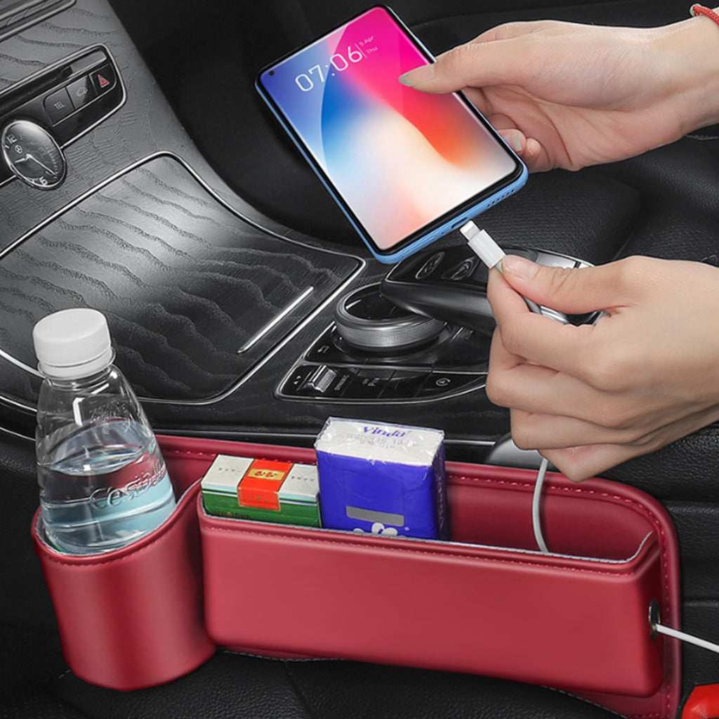 Red gap organizer holding a bottle, phone and tissues beside the seat