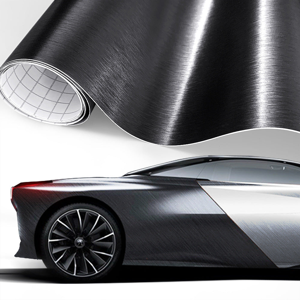 Brushed-metal style vinyl wrap film shown on a car (black)