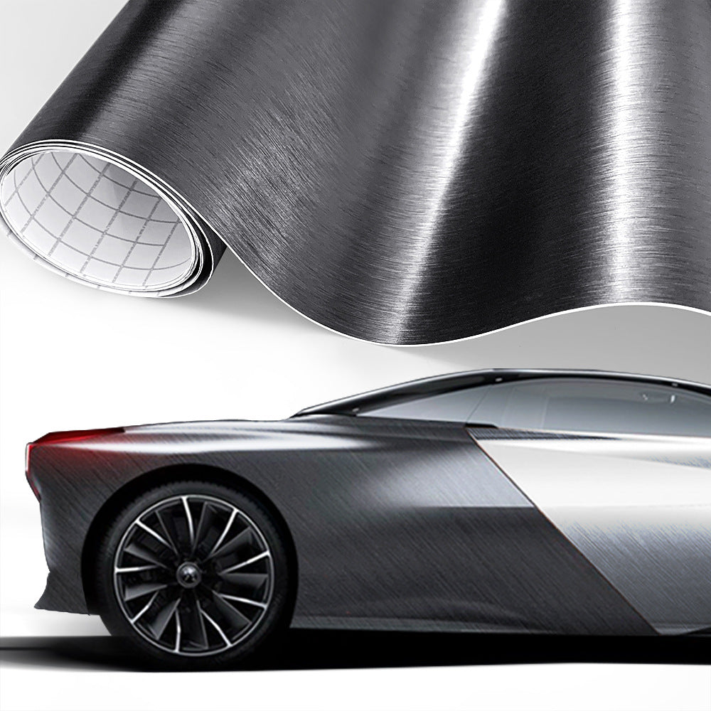Brushed-metal style vinyl wrap film shown on a car (dark grey)