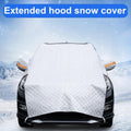 Extended hood silver windshield snow cover in winter landscape