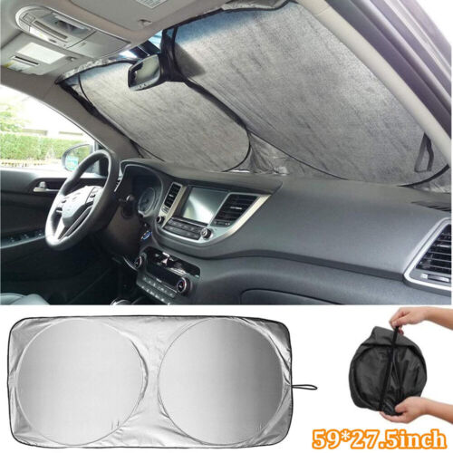 Silver reflective sunshade inside a car windshield
